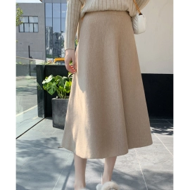 Knitted skirt for women in spring 2023, new style solid color sweater, versatile medium length high-waisted A-line sweater